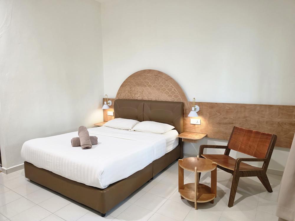 Room with wood and rattan headboard